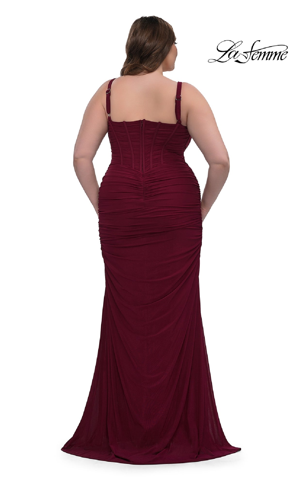 A woman models the Plus-Size Sexy Long Prom Dress: La Femme 32402, a fitted sleeveless burgundy gown with gathered accents and a corset-style bodice, shown from the back on a white background. The La Femme logo appears in the top right corner.
